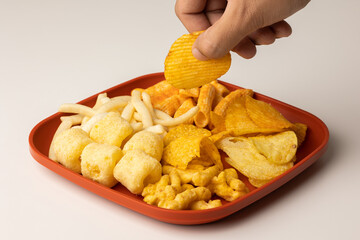 Many Crispy Snacks food potato chip salty. Fast food or junk food snacks unhealthy concept.