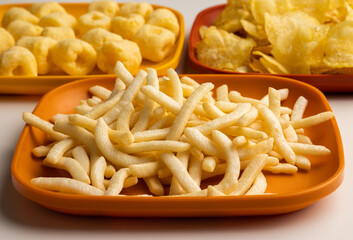 Many Crispy Snacks food potato chip salty. Fast food or junk food snacks unhealthy concept.