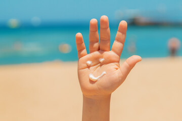 Sunscreen on the skin of a child. Selective focus.