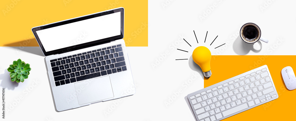 Poster computers with a light bulb from above