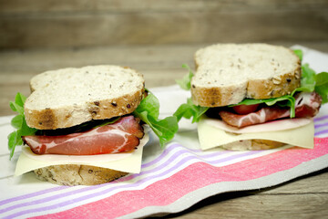Homemade sandwich, sandwich with smoked prosciutto and cheese
