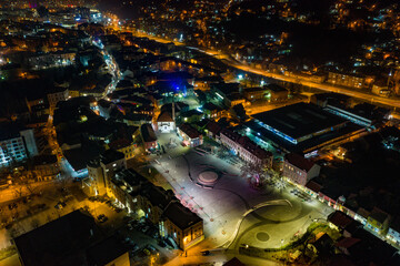 Aerial view of downtown Tuzla at night, Bosnia. City photographed by drone, traffic and objects , landscape