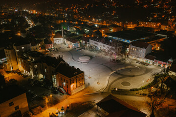 Aerial view of downtown Tuzla at night, Bosnia. City photographed by drone, traffic and objects , landscape