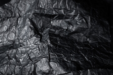 blackwrap used in filmmaking to direct light close-up on a black background