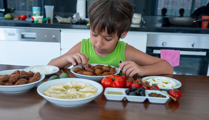 Boy is eating his breakfast