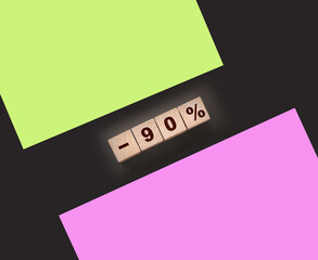 90% on wooden blocks on black background. Sale business concept