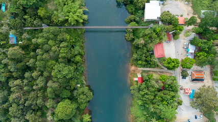 Aerial view Top down of suspension bridge across the canal in Khao Sok National Park Suratthani Thailand