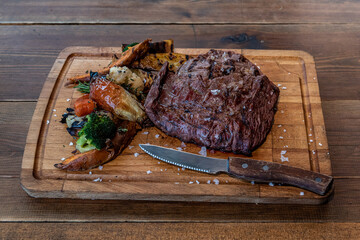 Argentine cut of meat called Vacio with chorizos and chimichurri