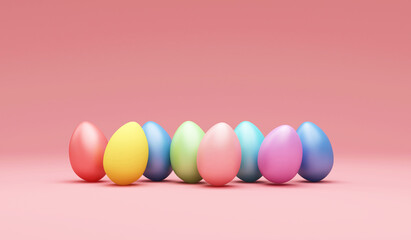 Fototapeta na wymiar Group of multicolored painted easter eggs on pink studio background