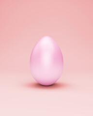 Painted easter egg on pink studio background