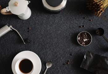 coffee cup and moka pot on black table background in kitchen room, coffee shop.