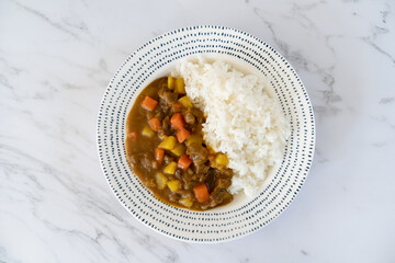 Home made Japanese beef curry served with Japanese rice in a plateใ