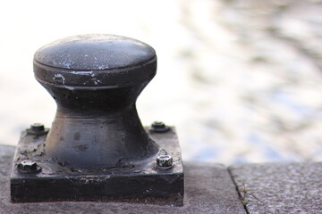 Closeup of cleat next to river