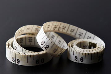 measuring tape on black background