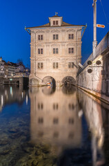 Beautiful Town Hall - Rathaus in Zurich, Switzerland at the Limmat river in the blue hour