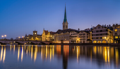Fototapeta na wymiar View of skyline of the swiss city Zurich reflecting on the Limmat river