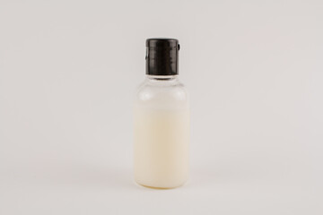 Fototapeta na wymiar white cream in a transparent jar on a white background