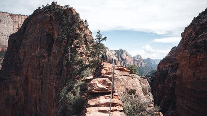 One man climbing up the angels landing in Zion National Park, Utah, USA