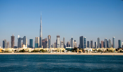 Dubai, UAE - 02.27.2021 Dubai public beach with city skyline on background. Outdoors