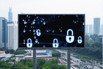 Padlock icon hologram on road billboard over panorama city view of Kuala Lumpur at day time to protect business, Malaysia, Asia. The concept of information security shields.