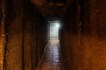 Dark corridor of old underground Soviet military bunker under artillery fortification