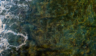 Beautiful sea waves with foam on the top of the water