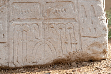 Egyptian inscription on white stone on the hill at Beit She'an National Park in Israel