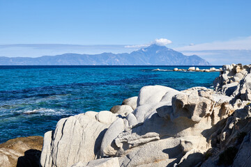 Holy Mount Athos seen from Sythonia, with turqoise water and cliffs, Halkidiki, Greece