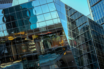 Futuristic designs with geometric patterns and creativity in modern architecture, glass reflections. Corporate offices.