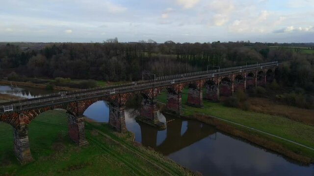 Dutton Viaduct is a railway viaduct on the West Coast Main Line where it crosses the River Weaver and the Weaver Navigation between the villages of Dutton and Acton Bridge in Cheshire, England