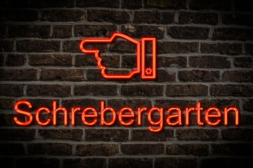 Fototapeta premium Leuchtreklame Schrebergarten