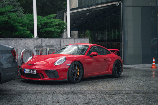Kyiv, Ukraine - August 2020: red Porsche 911 991.2 GT3 in the rain