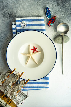 Overhead view of a nautical themed place setting on a table