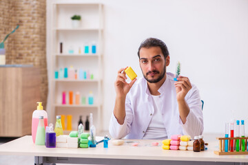 Young male chemist testing soap in the lab