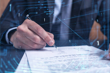 A client in dark blue suit is signing a contract to create a new software to present it in start up conference and gain investments to create a product. Technological graph over the desk.