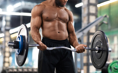 Fototapeta na wymiar Cropped of black muscular guy bodybuilder lifting weights