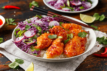 Korean Fried chicken with red cabbage salad and white rice. Asian food