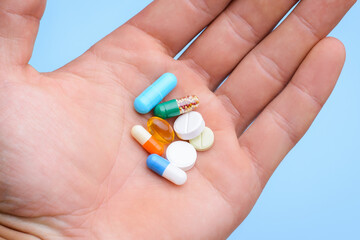 Group of pills in a hand. Medicine concept