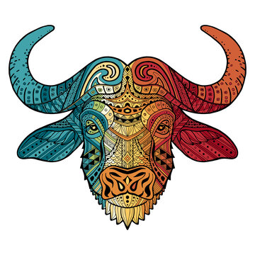 Patterned colorful head of a bull, bison. Abstract ethnic image of african buffalo with an unusual ornament. Colorful rainbow decoration painted by hand. Series of animals in the ethnic style. Vector