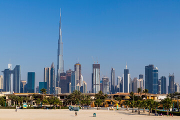 Dubai, UAE - 02.27.2021 Dubai public beach with city skyline on background. Outdoors