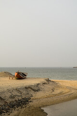 Old wooden boat on the beach in Fujairah 