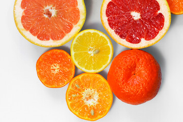 Sliced citrus on a white background. Grapefruit, lemon, tangerine.