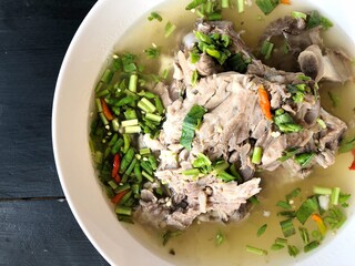 Giant dish of Thai style food. Hot and Spicy Soup with Pork Ribs. Spicy Pork with Pork bone Soup (Lang Zaap). Is a spicy and popular food in Thailand Tourists like it very much.