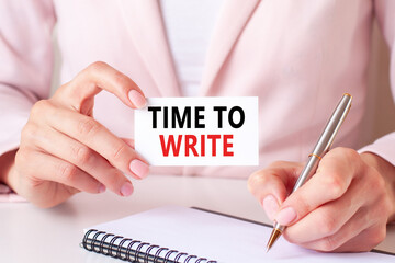 a card in the hands of a woman with the inscription TIME TO WRITE