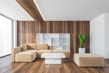Fototapeta na wymiar Beige sofa in wooden and white living room with plant and shelf in wall