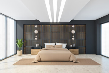 Black and beige bedroom with bed and window
