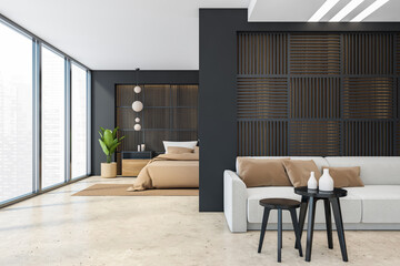 Black and beige bedroom with sofa and bed