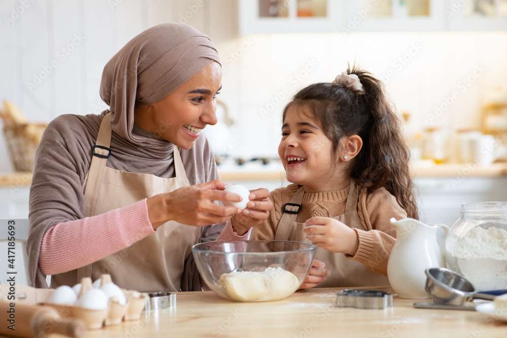 Canvas Prints Family Traditions. Happy Muslim Mom And Little Daughter Having Fun While Baking