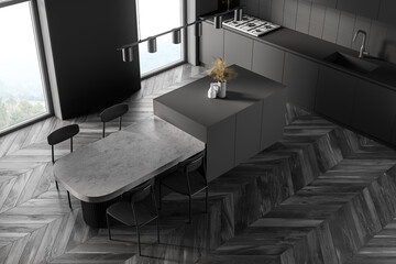 Dark modern kitchen interior near window. Dining area with table. Wooden parquet floor. Panoramic...