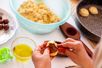 Arabic woman hands making eid sweets ,cookiesand mamoul